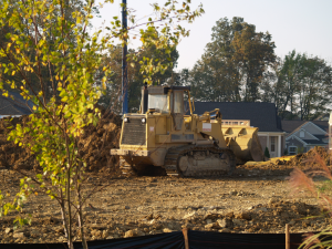 file000580911810 grader & house construction 40 percent